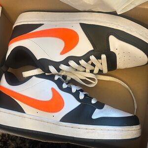 Nike Black and White Sneakers with Orange Swoosh